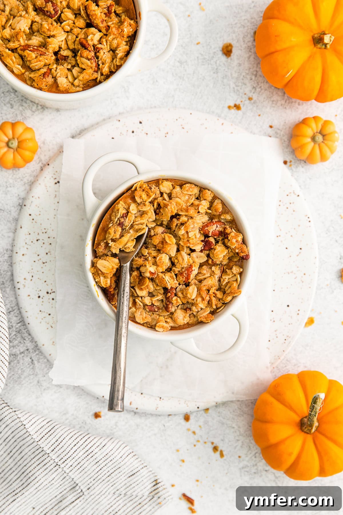 A spoon going into Pumpkin Crisp.