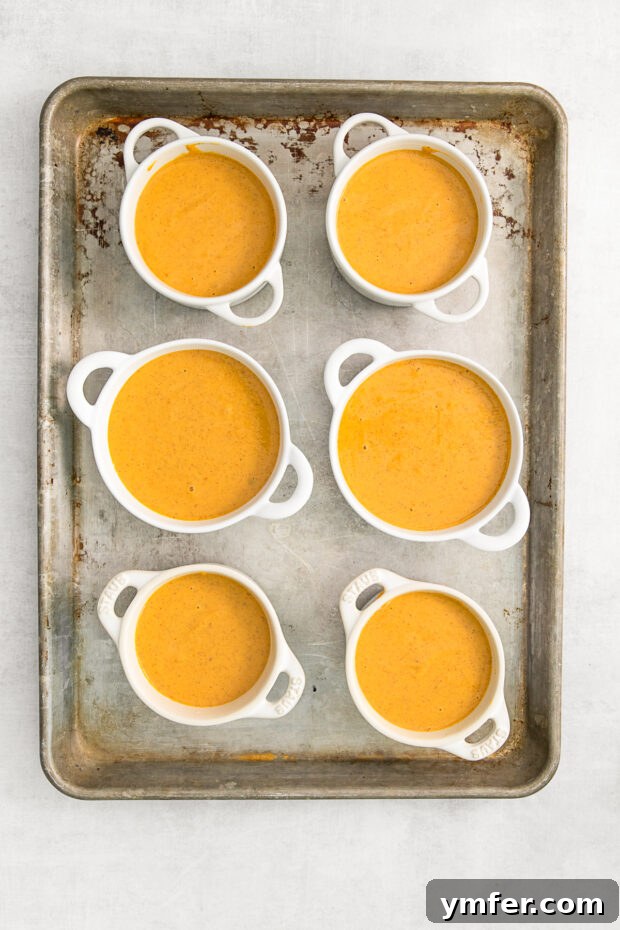Uncooked pumpkin crisp in ramekins.