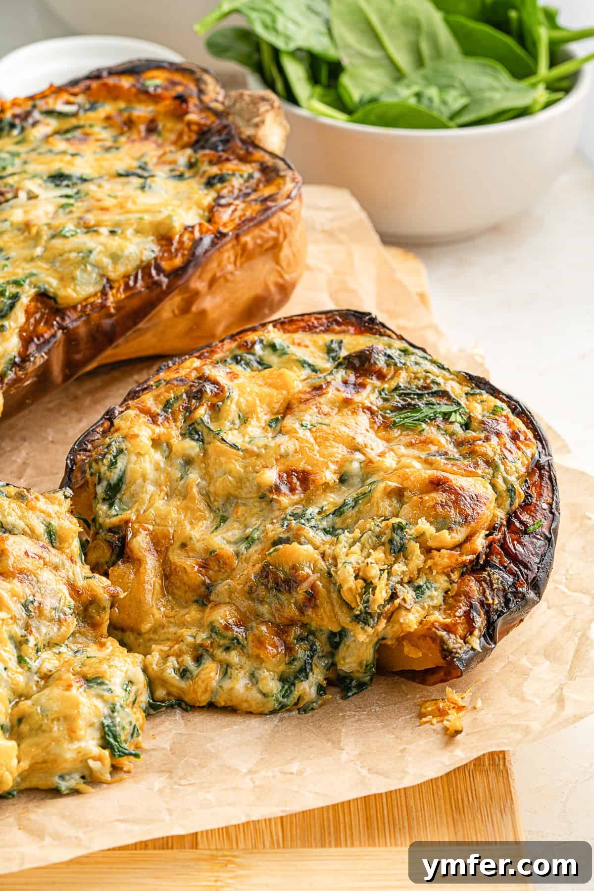 Creamy Cheesy Butternut Squash Bake 7 A Cheese Stuffed Butternut Squash cut in half, showcasing the creamy filling and golden crust.