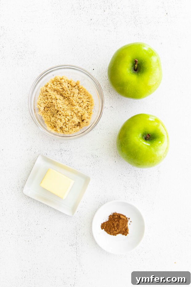 Cinnamon Apple Pie Cupcakes 3 Ingredients for homemade apple pie filling laid out on a table, including chopped apples, brown sugar, butter, and apple pie spice.