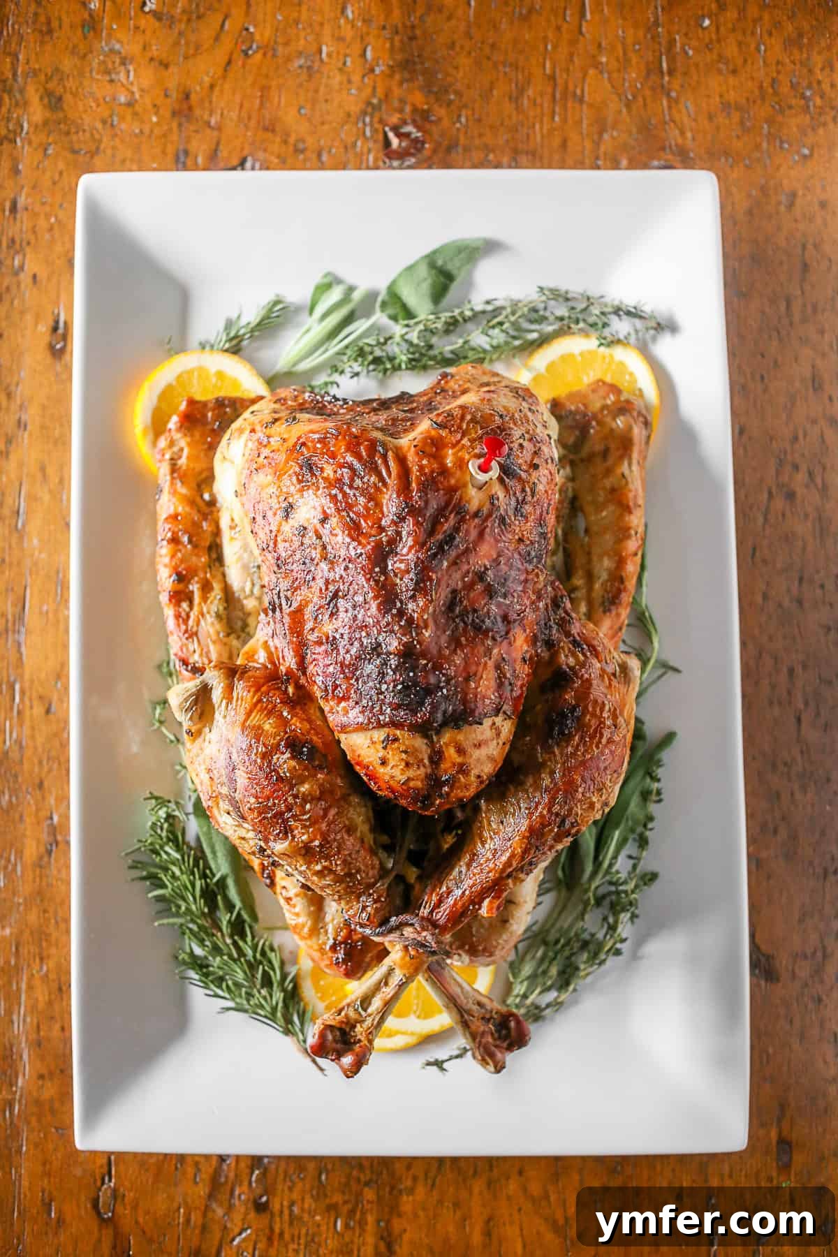 An incredibly moist Herbed Mayonnaise Roasted Turkey with perfectly crispy skin, featuring aromatic herbs and a secret ingredient for ultimate flavor.