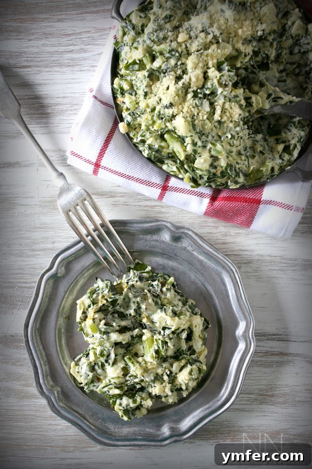 A Feast of Thanksgiving Sides 21 Rich and creamy creamed kale, a savory green side dish, served on a small white plate.