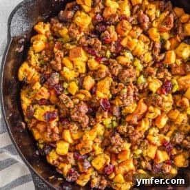 Close-up of potato bread stuffing with sausage and cranberries.