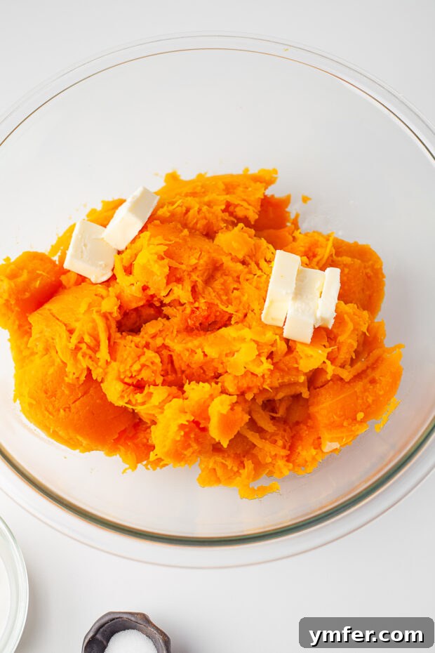 Creamy Instant Pot Butternut Mash 5 Butternut squash pieces arranged on a trivet inside an Instant Pot.