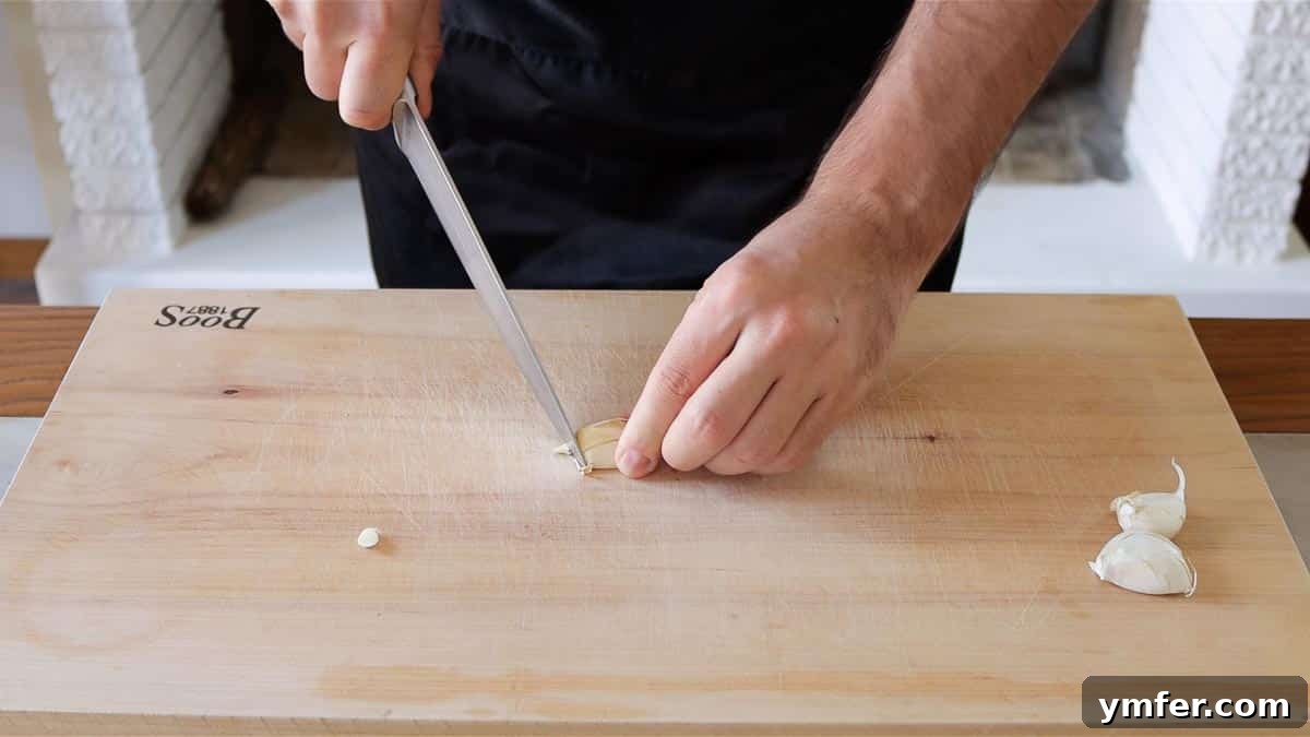 Mincing Garlic: From Rough Chop to Smooth Paste 4 cutting off the root end