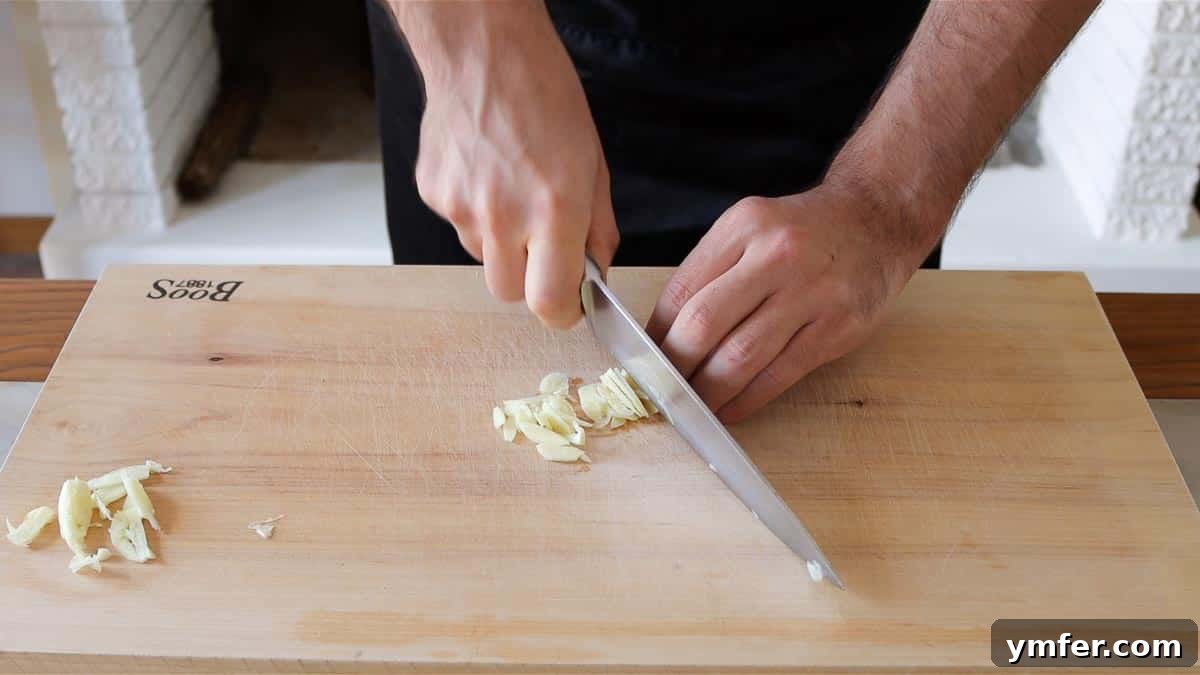 Mincing Garlic: From Rough Chop to Smooth Paste 5 slicing the garlic