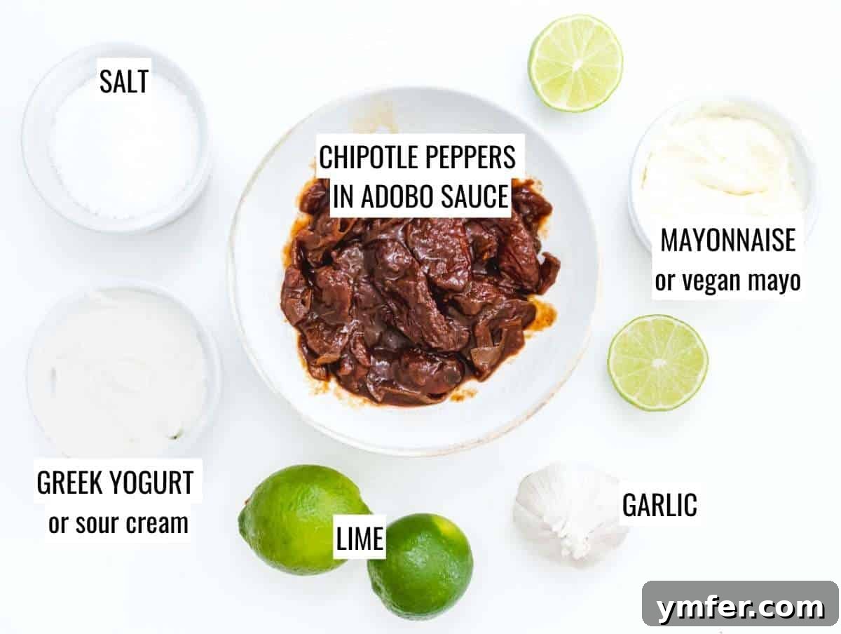 Smoky Chipotle Sauce 5 A selection of fresh ingredients laid out for making chipotle sauce: chipotle peppers, Greek yogurt, mayonnaise, lime, garlic, and salt.