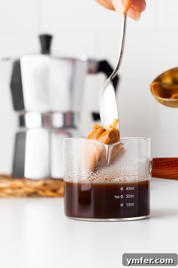 Spiced Biscoff Cookie Butter Latte 4 Espresso being poured into a glass, ready for mixing.