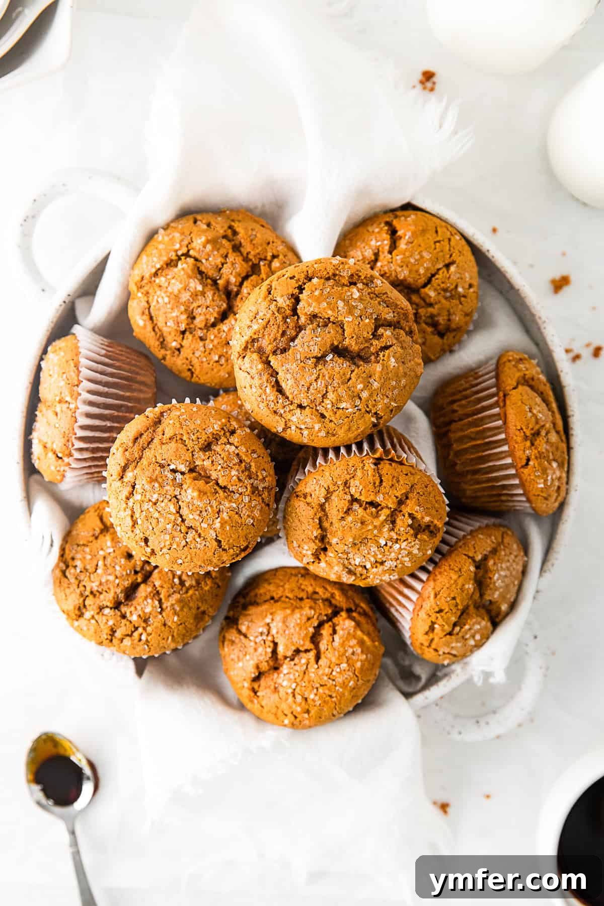 Spiced Molasses Muffins 2 Delicious gingerbread muffins, perfectly baked and arranged in a serving bowl, ready to be enjoyed.