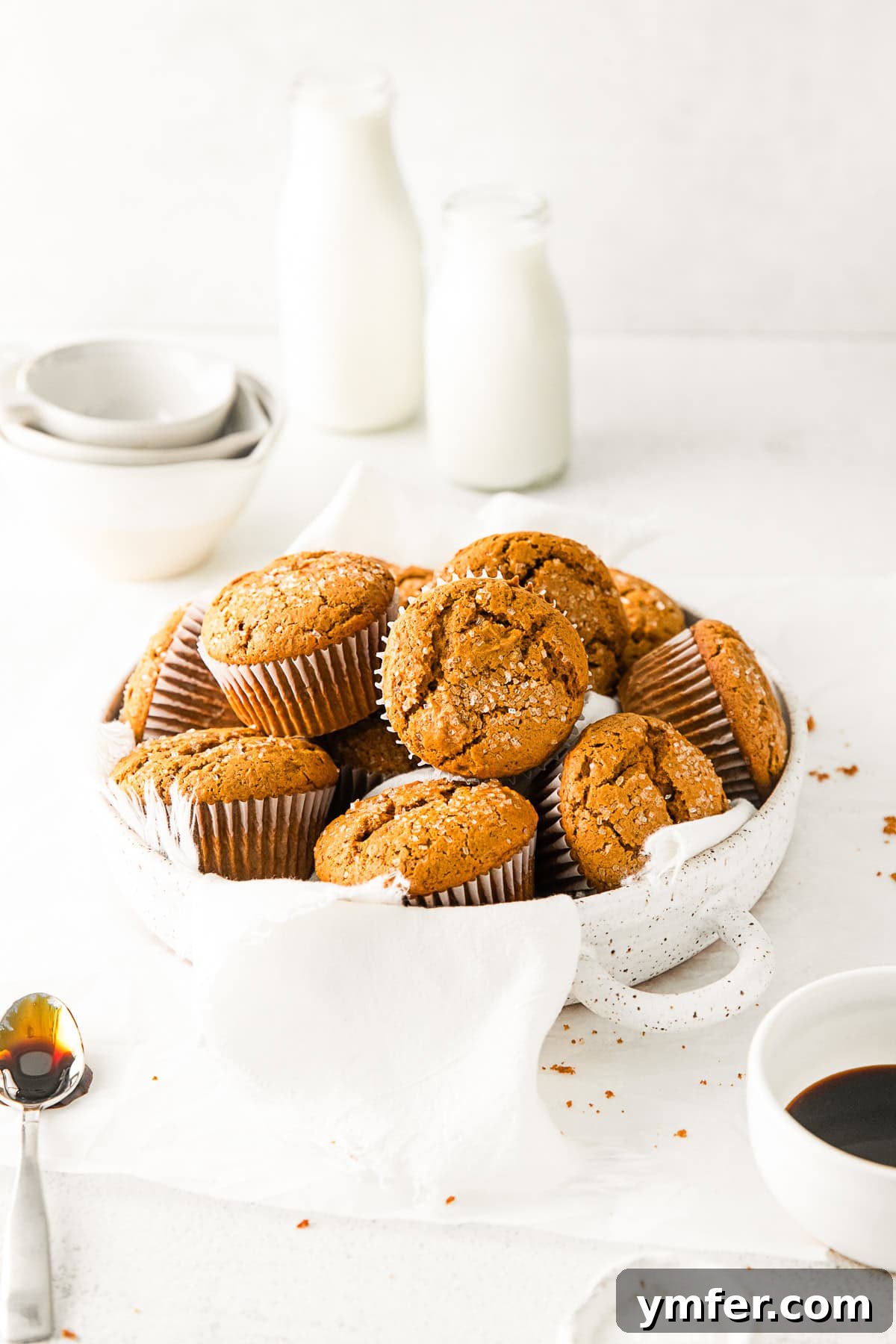 Spiced Molasses Muffins 7 Close-up of golden gingerbread muffins, generously topped with coarse sugar for an added crunch and sparkle.