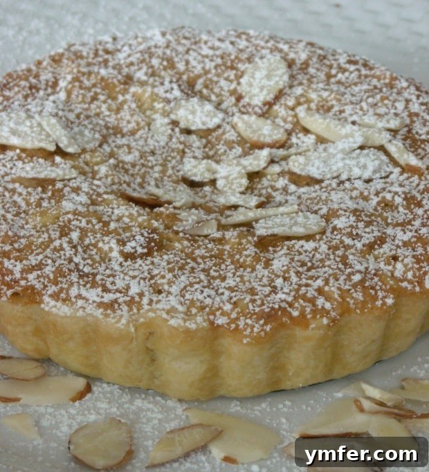 Delicious Bakewell Tart with a golden crust and almond topping