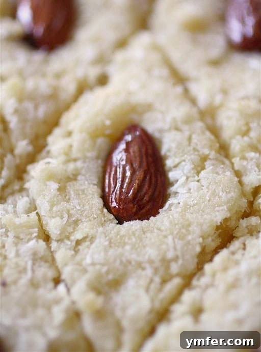 Golden Semolina Syrup Cake 3 This basbousa is made with semolina flour, almonds, coconut and a delicious rose water scented sugar syrup. It's so delicious and so easy to make!