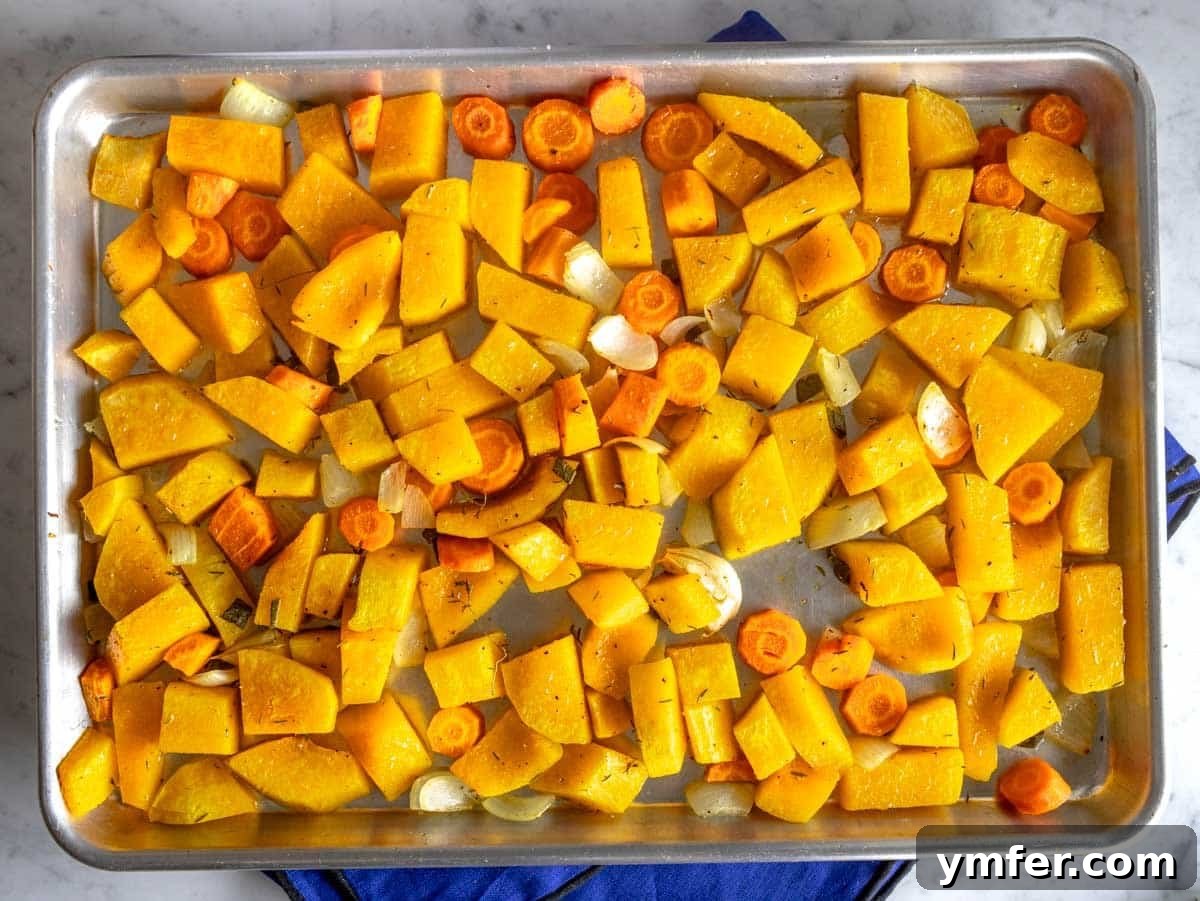 Velvet Butternut Comfort 7 Roasted butternut squash and carrots on a baking tray after baking until tender