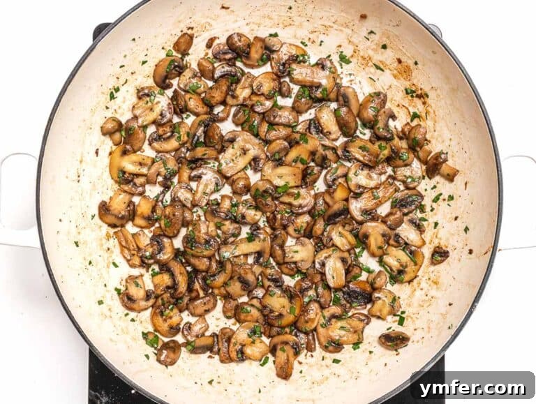 Sauteed mushrooms with garlic and parsley in a skillet