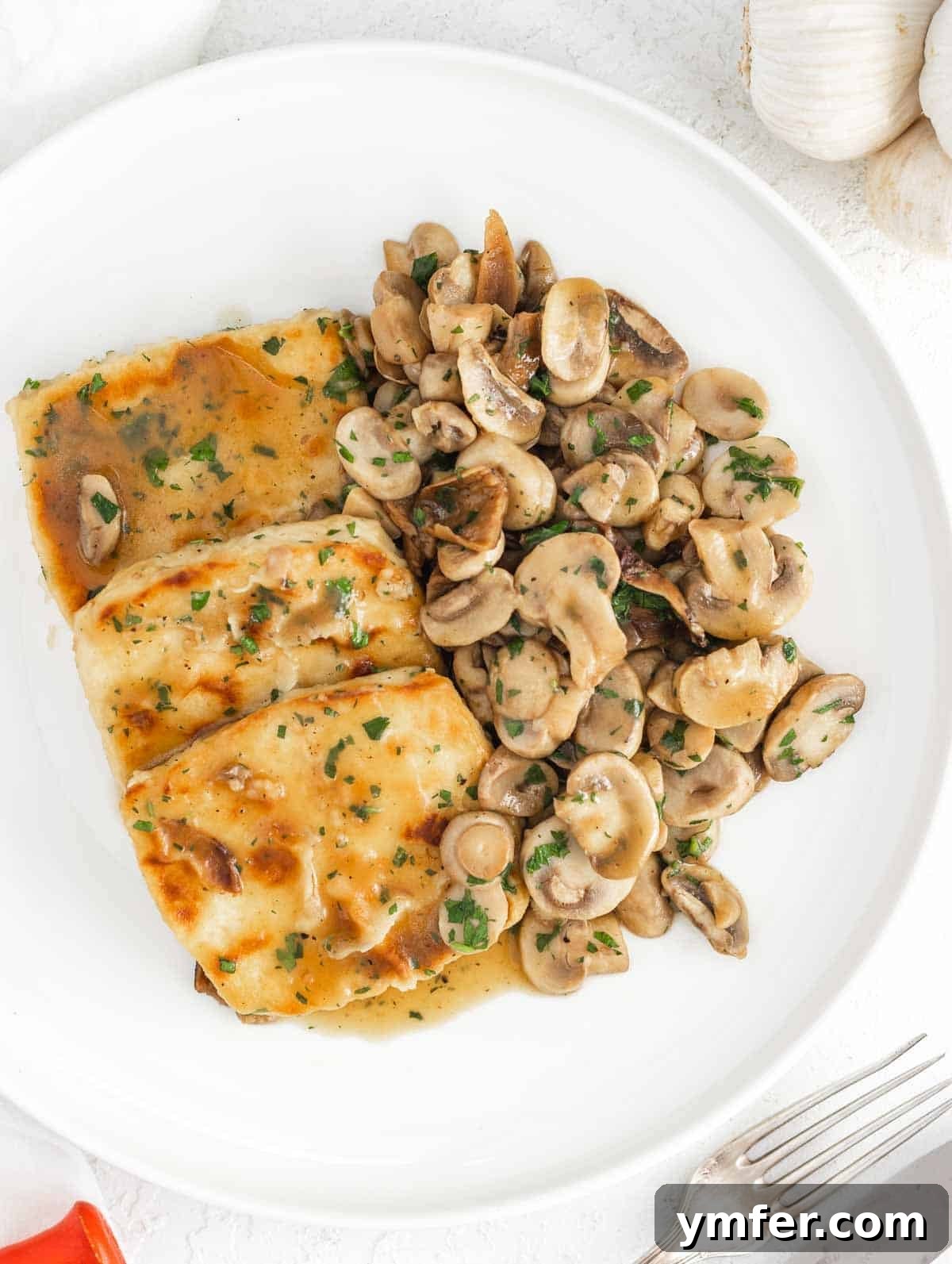 Flavorful Tofu Mushroom Medley 2 Delicious mushroom tofu scaloppine served on a plate, ready to eat.