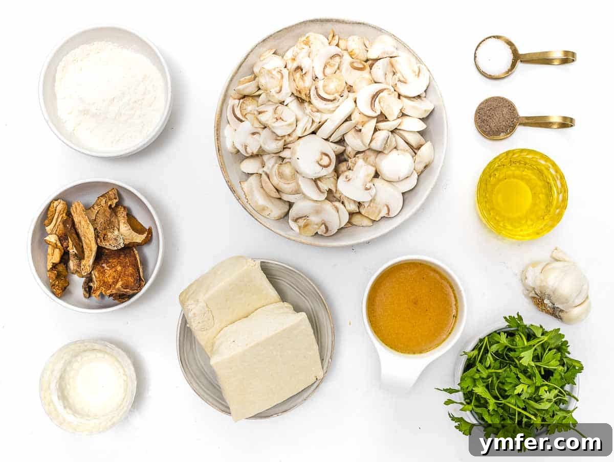 Flavorful Tofu Mushroom Medley 4 All the fresh ingredients for the tofu mushroom recipe laid out on a table.