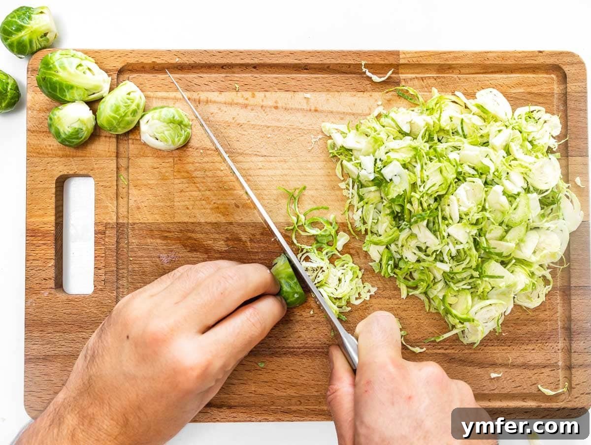 Crunchy Brussels Sprout Ribbon Salad 5 cutting the Brussels sprouts with a knife