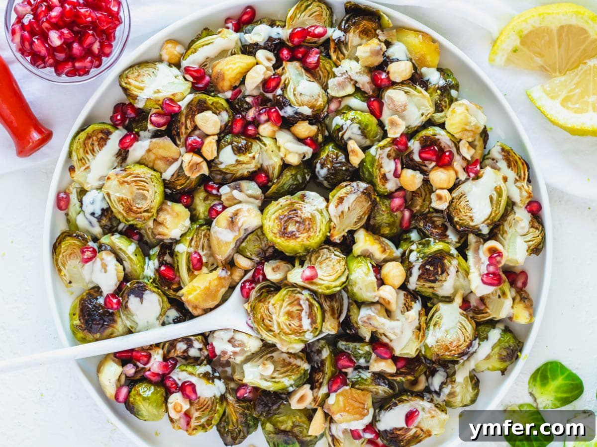 Crispy Roasted Brussels Sprouts 3 Roasted Brussels Sprouts with tahini sauce and pomegranate seeds, a gourmet touch.