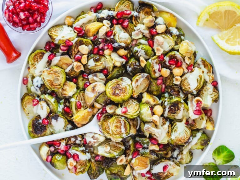 Roasted Brussels Sprouts with tahini sauce and pomegranate seeds