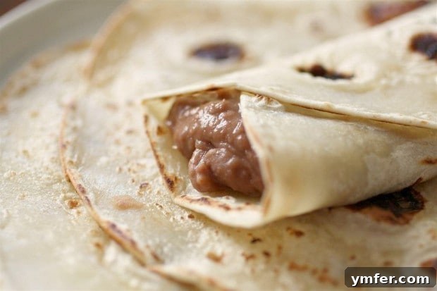 Down Home Pinto Beans 3 These Southern style pinto beans only take 4 ingredients and cost less than $5 to make! They are perfect eaten plain or rolled up in a soft flour tortilla.