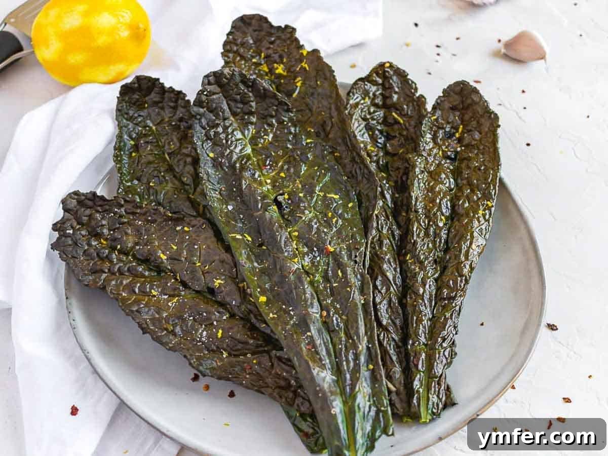 Kale Crunch 5 Whole dinosaur kale chips arranged beautifully on a plate