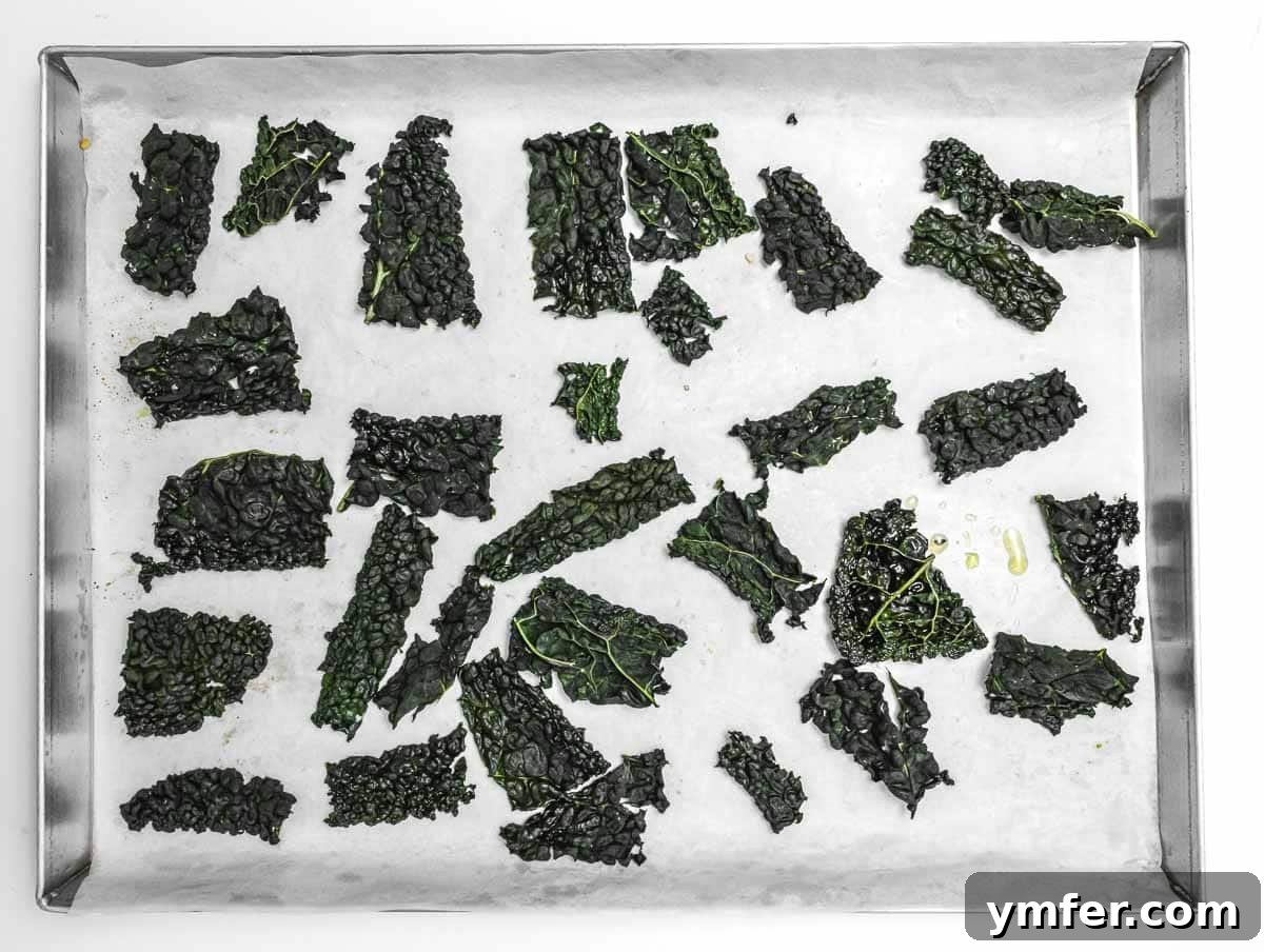 Kale Crunch 10 Freshly baked crispy kale chips cooling on a tray