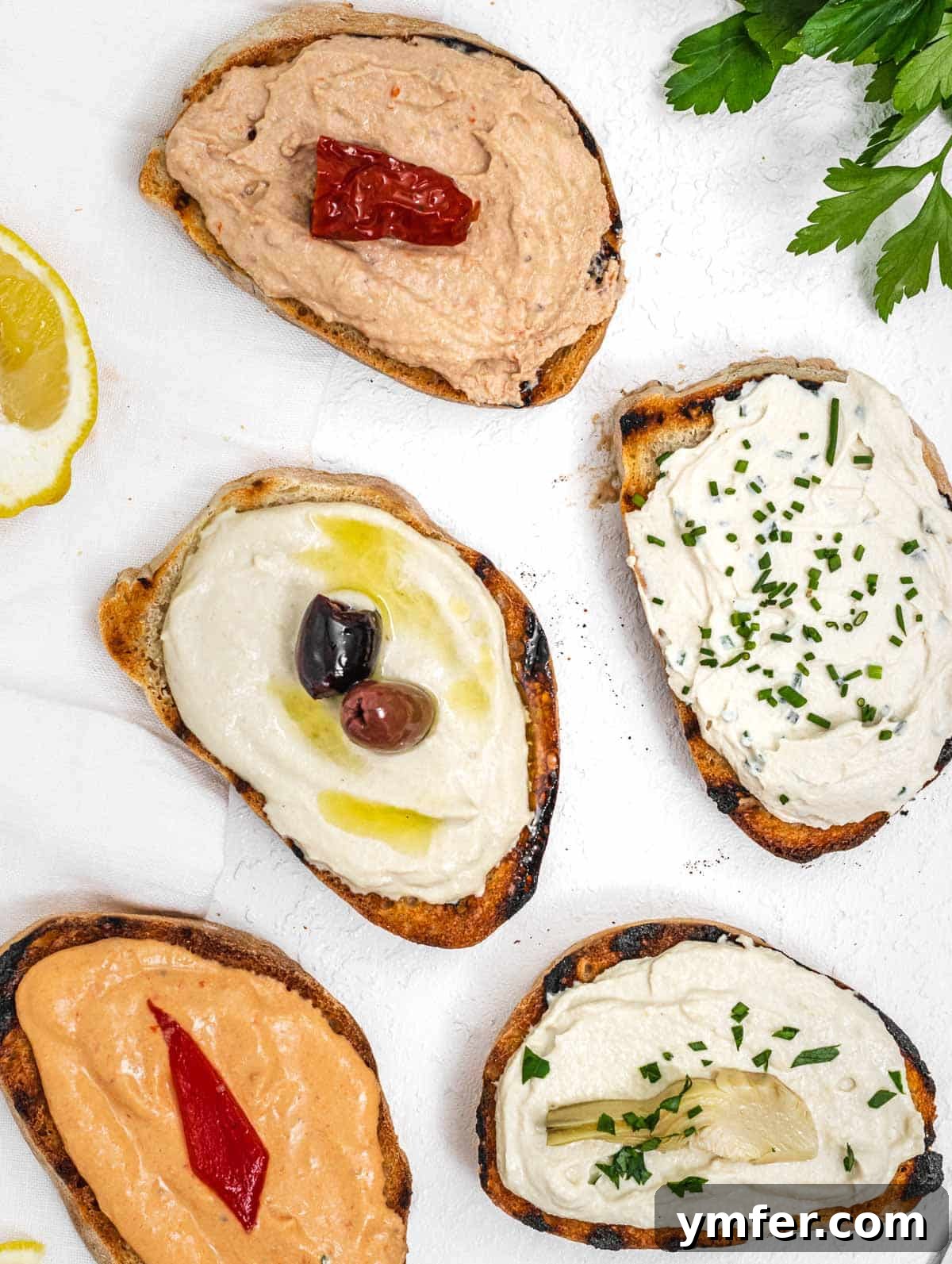 Tofu cream cheese spread generously on golden toasted bread slices, garnished with fresh herbs