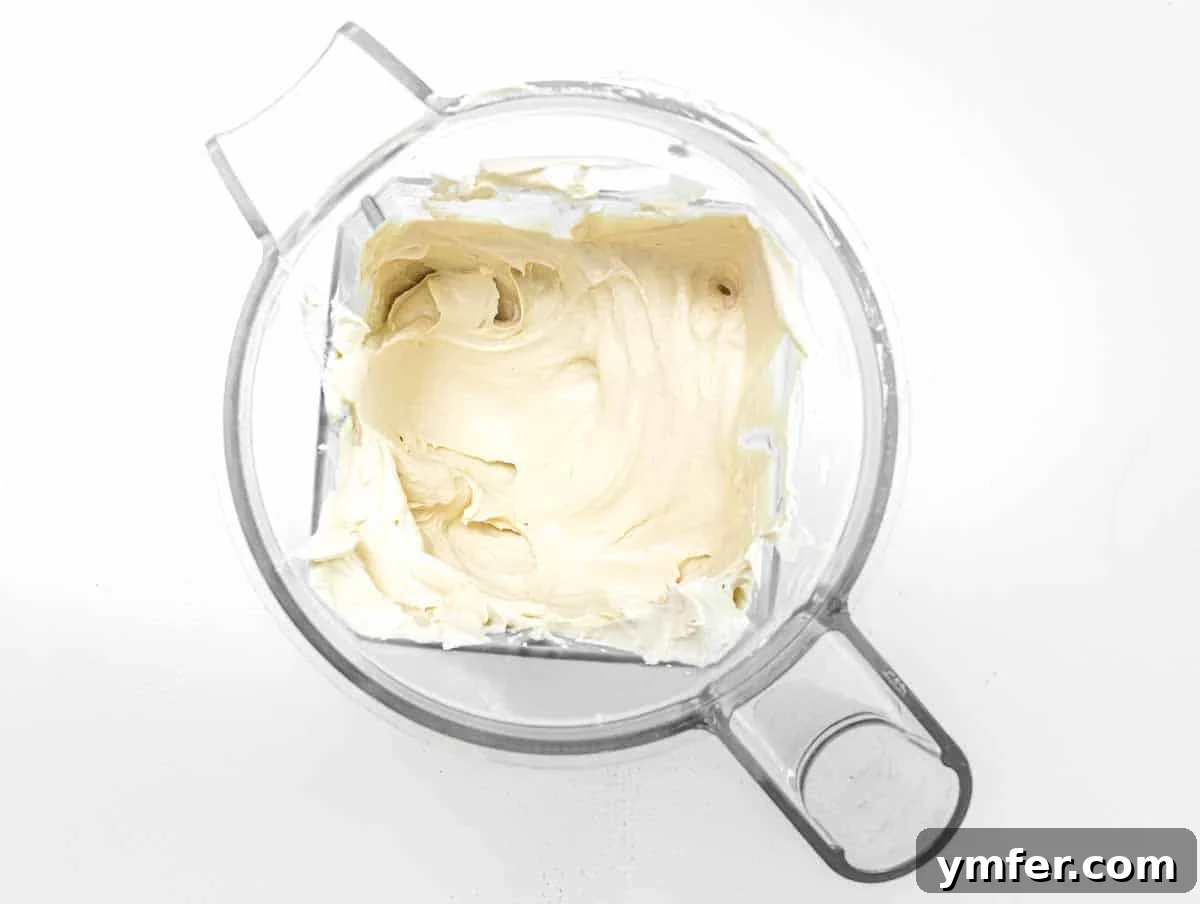 Close-up of perfectly blended, smooth and creamy tofu mixture in a blender