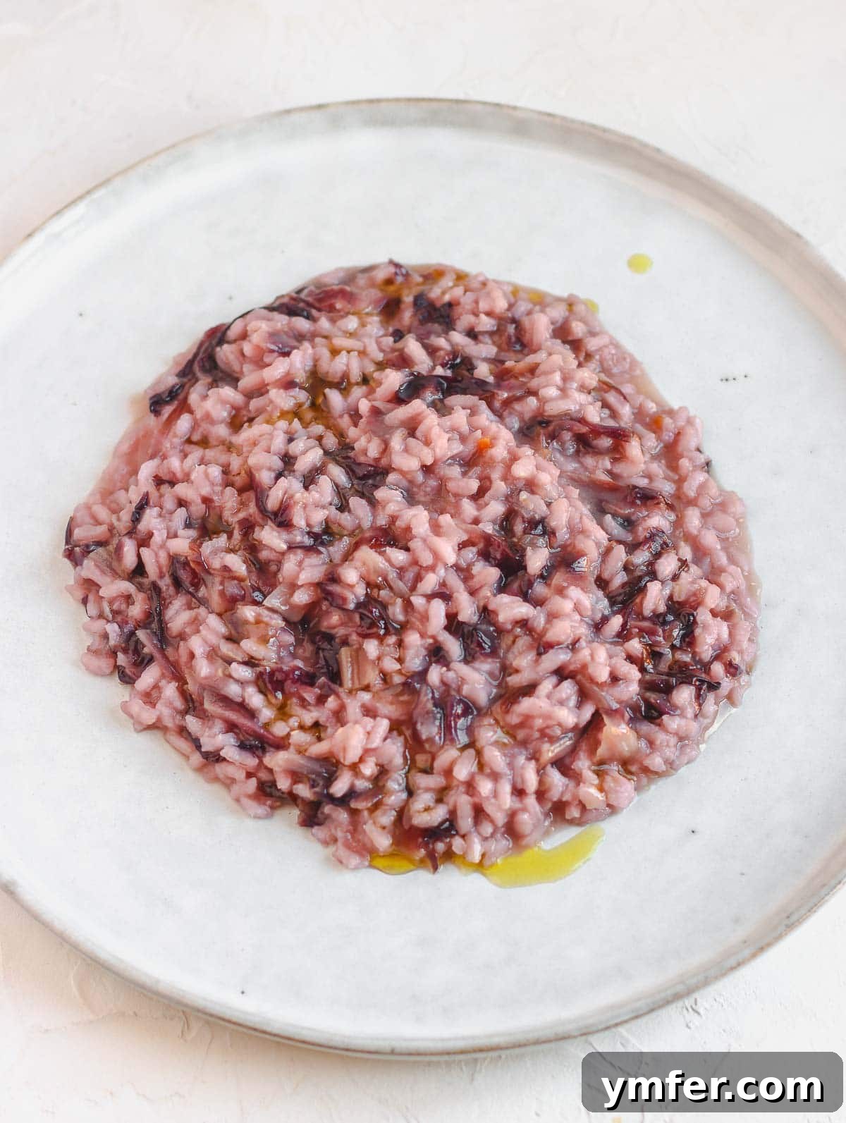 Effortless Plant-Based Risotto 7 Vibrant vegan chicory risotto, showcasing the beautiful red hue of the vegetable.