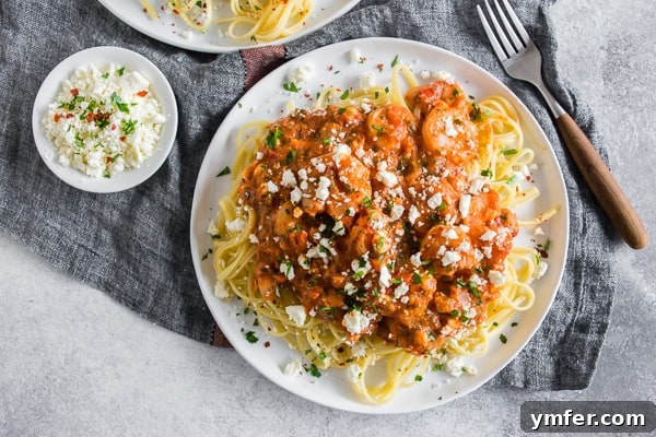 Baked Feta and Shrimp Pasta 5 A plate of Shrimp Feta Pasta generously topped with additional crumbled feta cheese, enhancing its visual appeal and flavor.