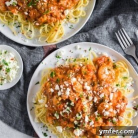 This pasta with shrimp and feta is a flavor-packed weeknight or special occasion meal. My husband grew up eating this dish and it's his all-time favorite. Garlicky shrimp mixed with a feta packed sherry tomato sauce served over perfectly cooked pasta - what's not to love?