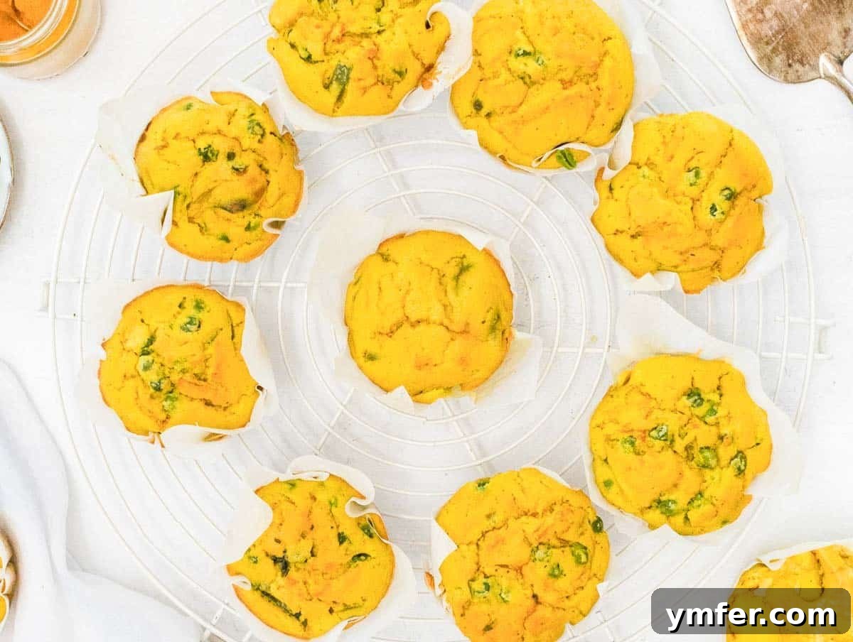 Wholesome Chickpea Egg Muffins 3 Chickpea Muffins on a cooling rack with peas and cauliflower
