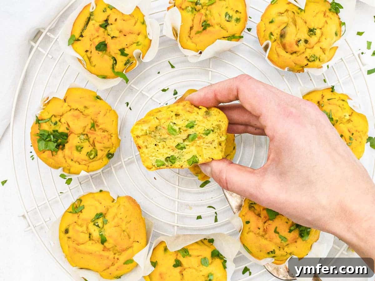 Wholesome Chickpea Egg Muffins 4 Chickpea Muffins and hand holding a muffin cut in half