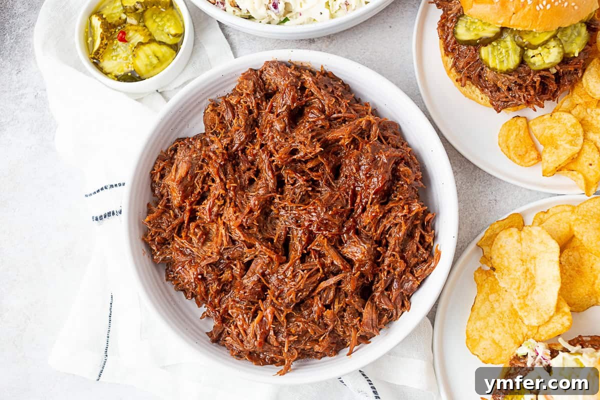 Smoky Pulled Beef Sandwiches 6 Large white serving bowl filled with delicious BBQ beef.