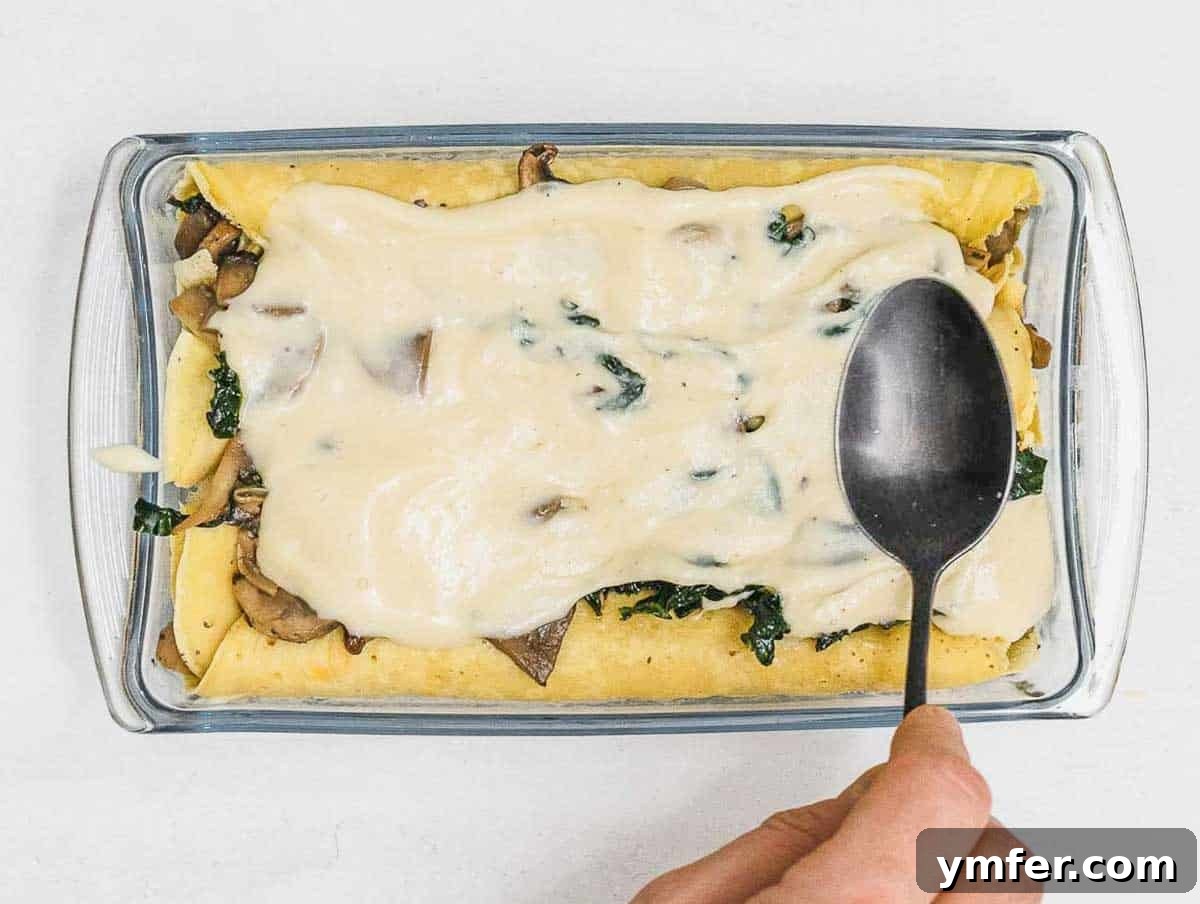 Savory Crepe Delights 16 Savory crepes arranged in a baking dish, covered with sauce
