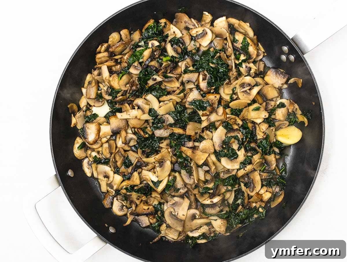 Savory Crepe Delights 5 Perfectly sautéed mushrooms and kale, ready for the crepes