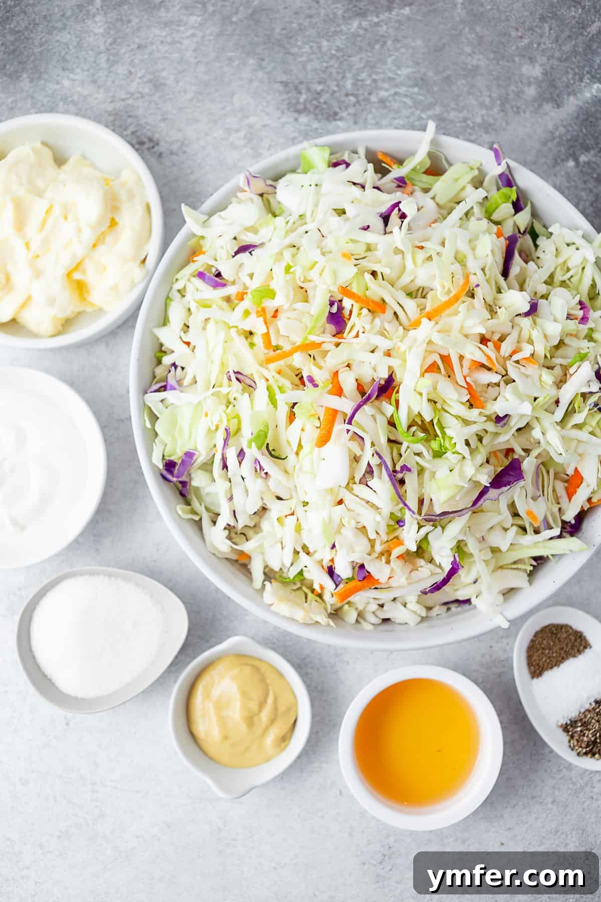 Velvet Cabbage Slaw 3 Ingredients to make Creamy Coleslaw on a table.