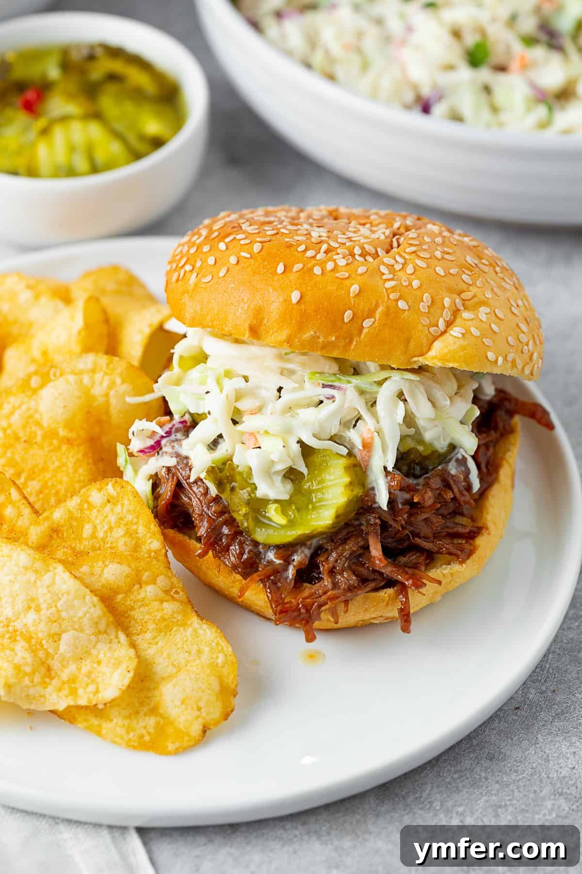 Velvet Cabbage Slaw 4 Creamy Coleslaw on top of a shredded beef sandwich.