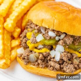 Ultimate Loose Meat Sandwich Maid Rite Inspired 5 Loose Meat Sandwich on a bun with pickles and onions