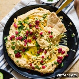 This tahini free lemon hummus is packed full of cashew butter, chickpeas and lots of lemon and garlic flavor. Perfectly smooth and perfect for dipping with toasted pita or crunchy vegetables. 