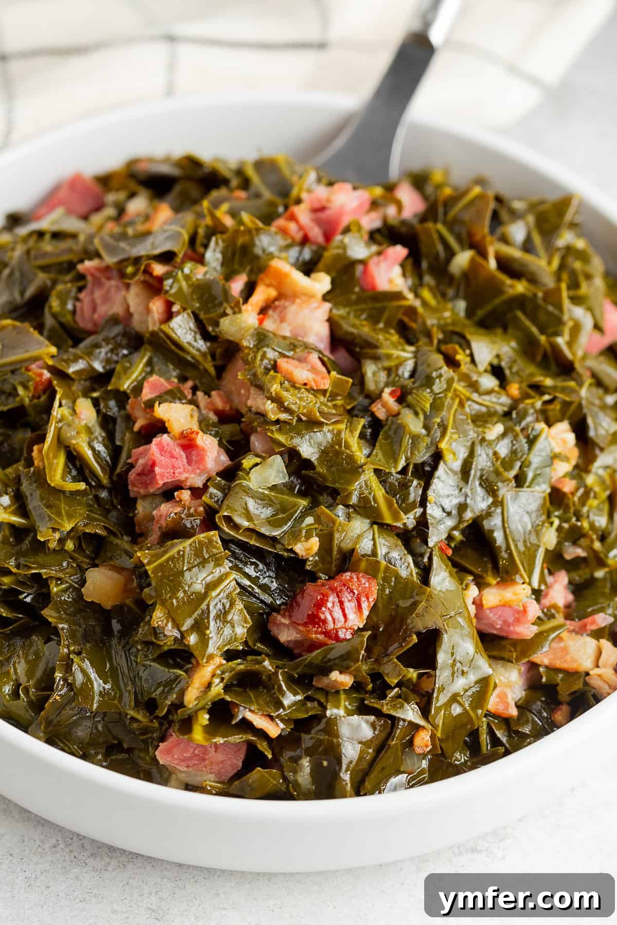 Flavorful Instant Pot Collard Greens 6 Instant Pot Collard Greens served with pieces of ham.