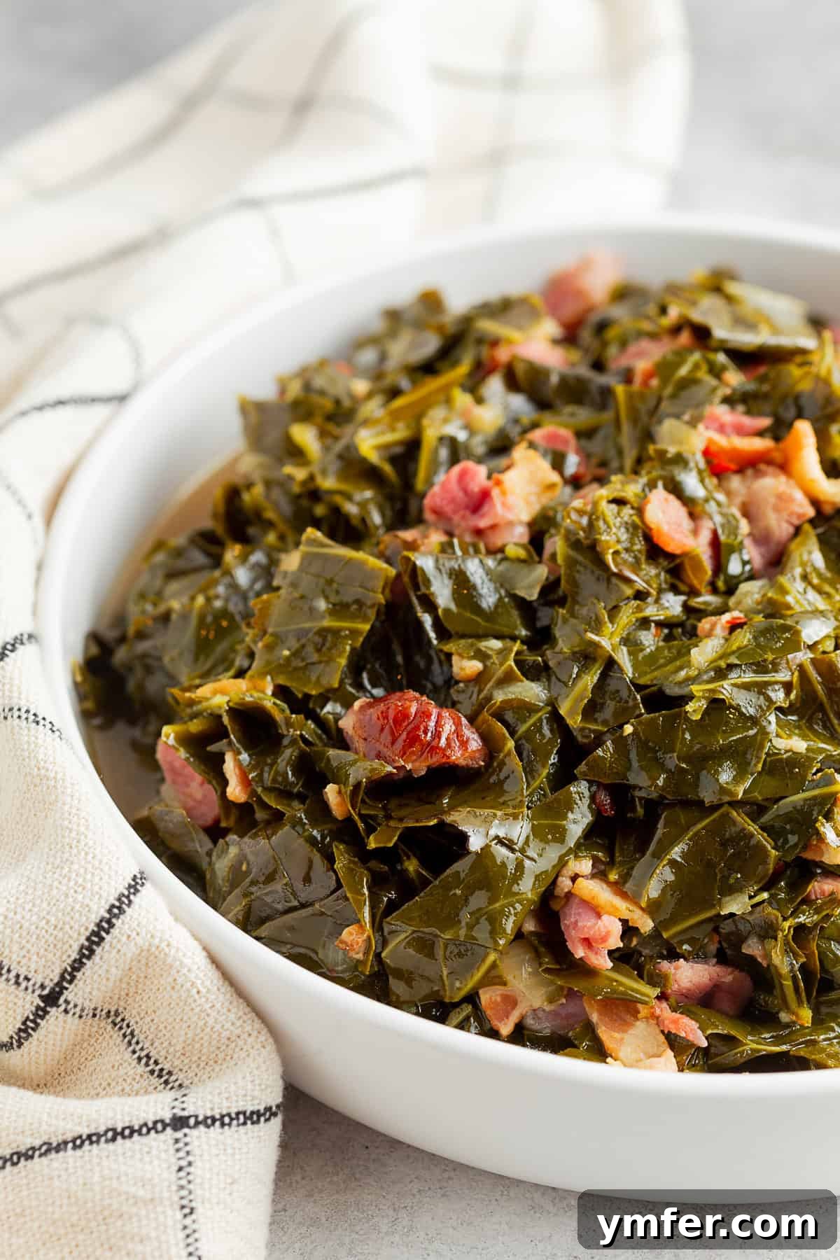 Flavorful Instant Pot Collard Greens 4 Instant Pot Collard Greens in a large white serving bowl.
