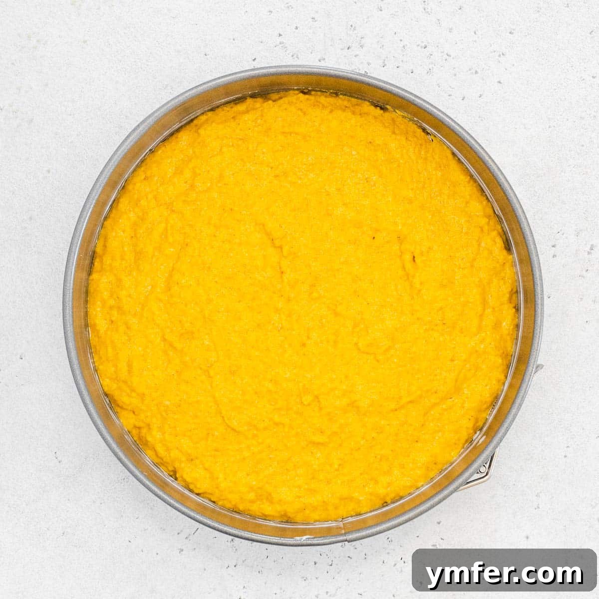 Dolce Carota Cake 12 Carrot orange cake batter neatly transferred into the prepared baking pan.