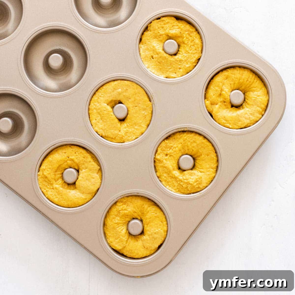 Dolce Carota Cake 18 A donut baking pan, prepped and ready for batter.