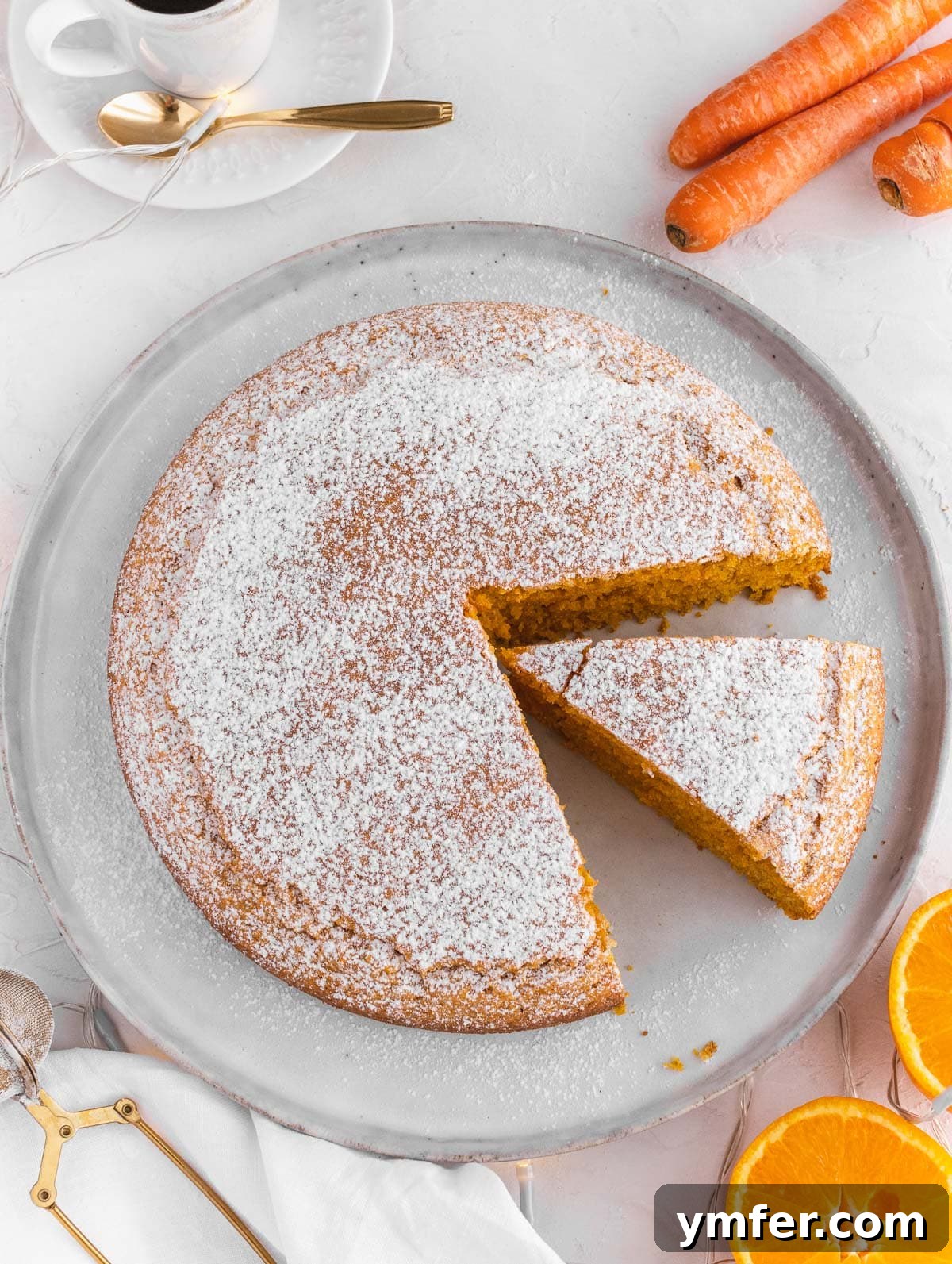 Dolce Carota Cake 3 A whole Italian carrot and orange cake, showcasing its golden-brown crust and inviting texture.