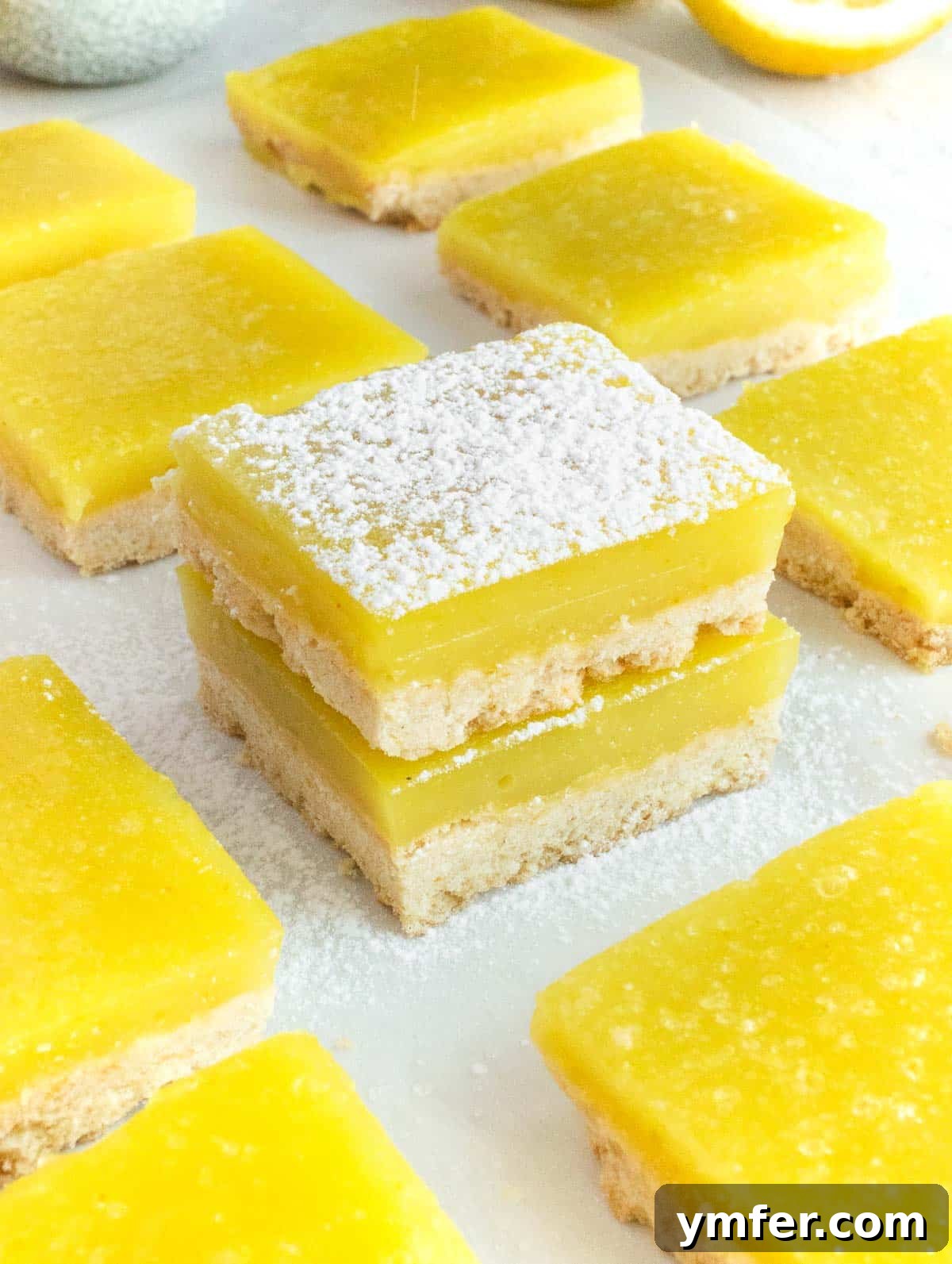 Zesty Plant-Based Lemon Squares 2 Deliciously vibrant vegan lemon bars arranged on a white plate