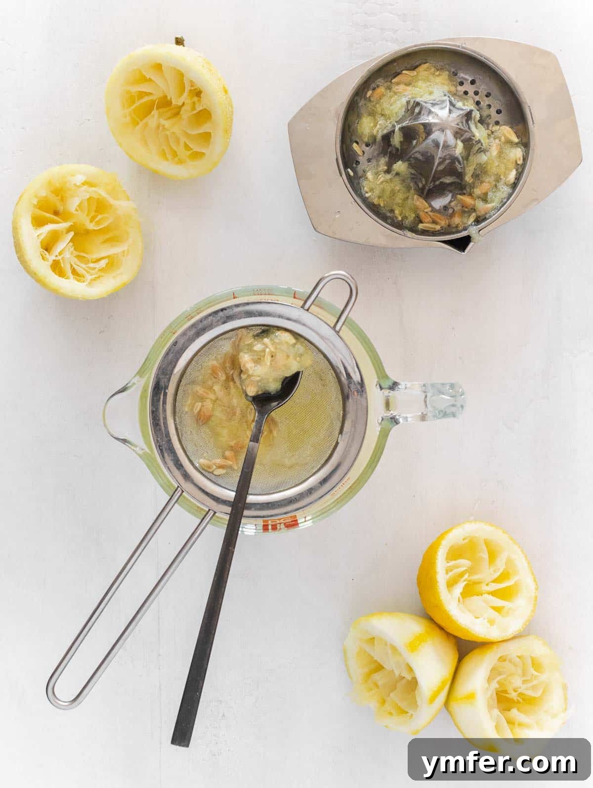 Zesty Plant-Based Lemon Squares 14 Squeezing fresh lemons for juice, which will be filtered to ensure a smooth lemon curd.