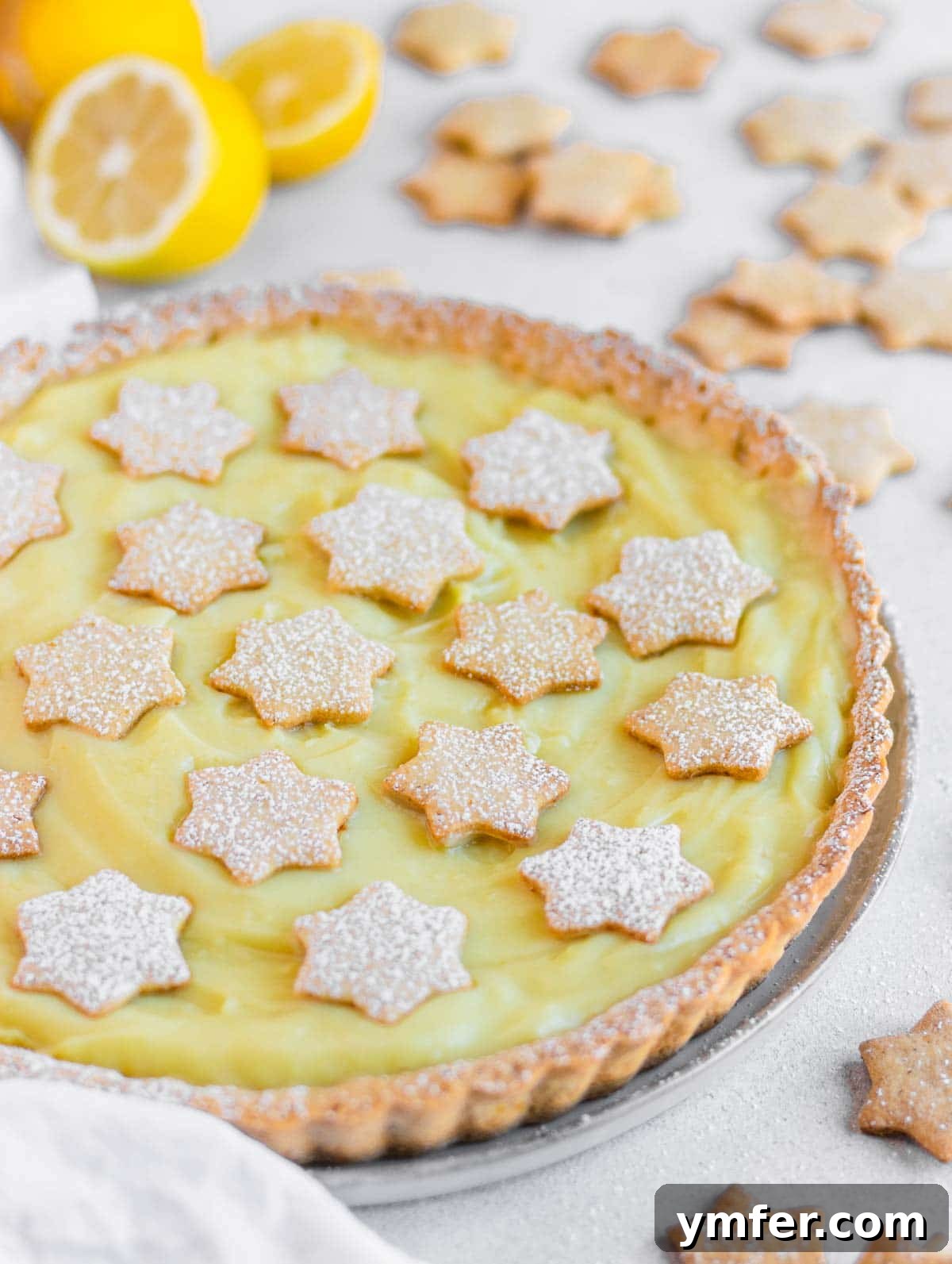 Zesty Plant-Based Lemon Squares 20 A slice of vegan lemon tart with a beautifully crunchy crust, topped with fresh berries.