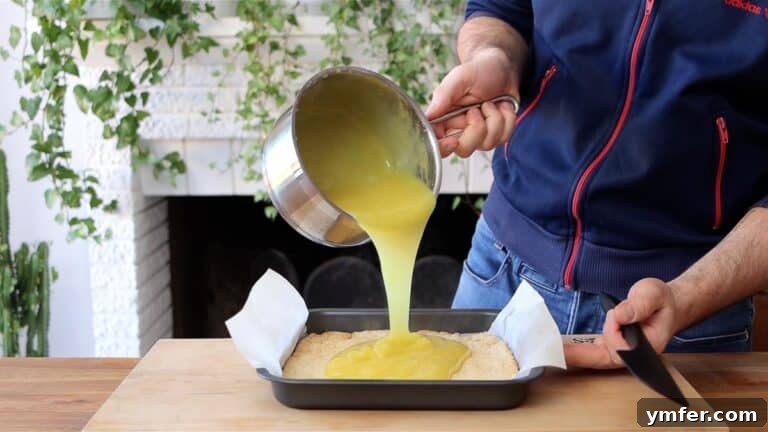 Zesty Plant-Based Lemon Squares 36 pouring curd over crust