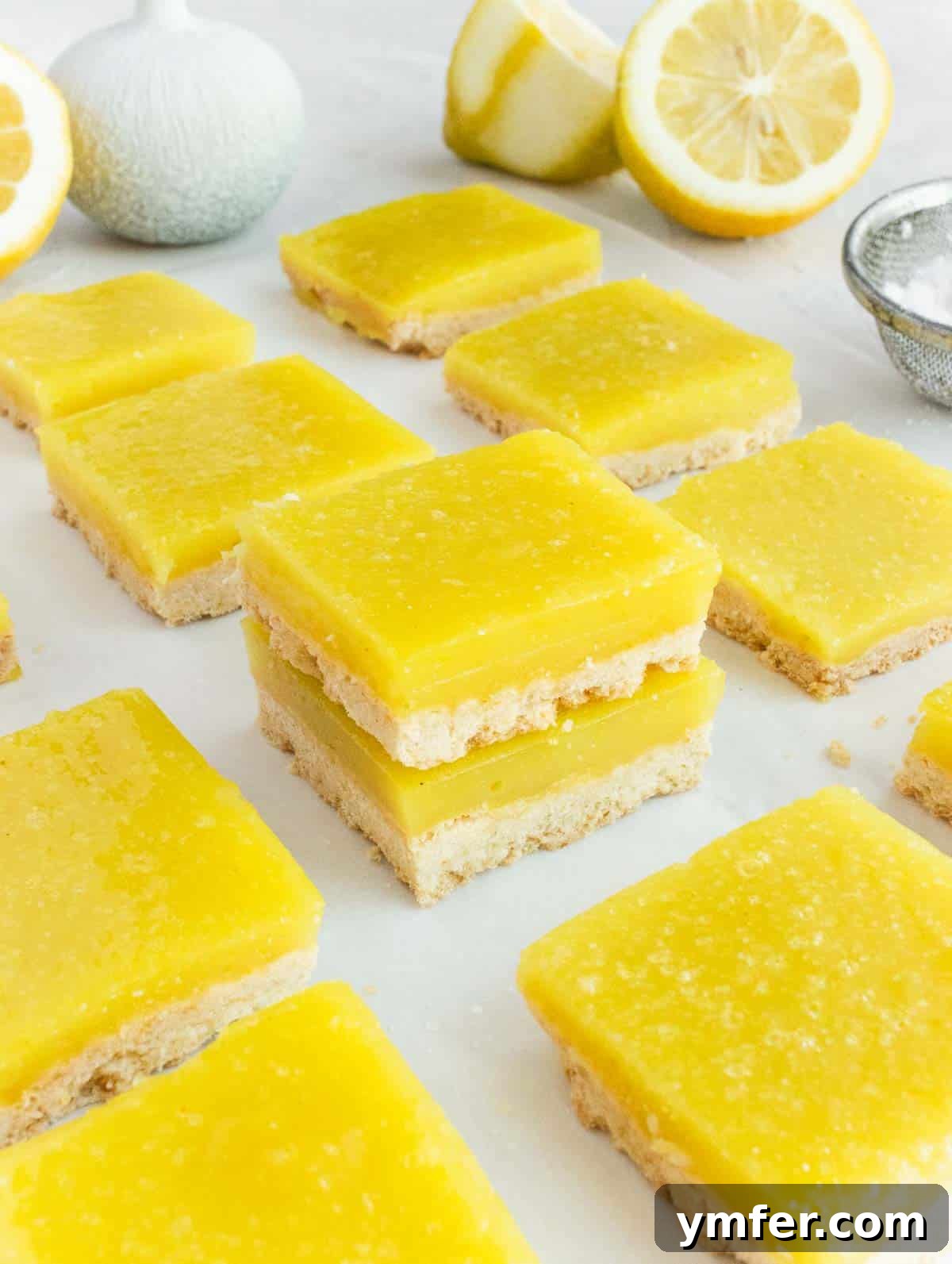 Zesty Plant-Based Lemon Squares 6 A freshly baked batch of vegan lemon bars, showcasing their vibrant color and smooth texture.